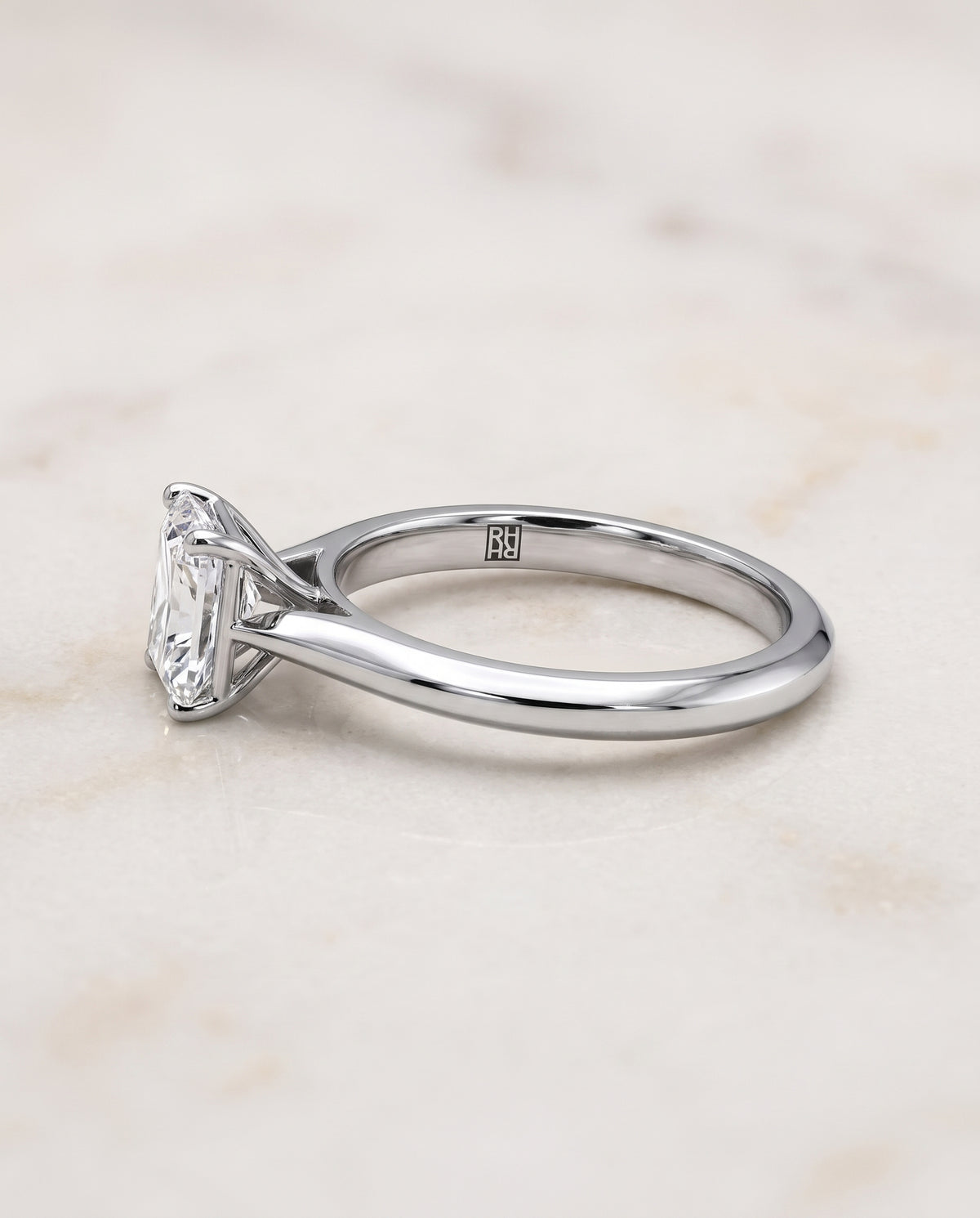 The Elena Timeless Graduated Beveled Shank Solitaire Radiant Cut Engagement Ring Setting in Platinum