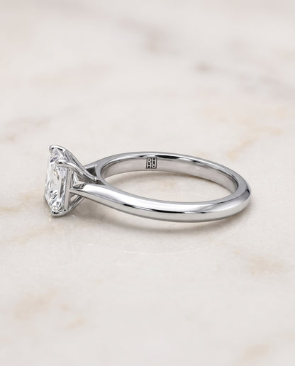 The Elena Timeless Graduated Beveled Shank Solitaire Radiant Cut Engagement Ring Setting in Platinum