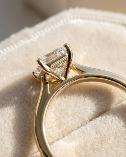 The Elena Timeless Graduated Beveled Shank Solitaire Radiant Cut Engagement Ring Setting in 18K Yellow Gold