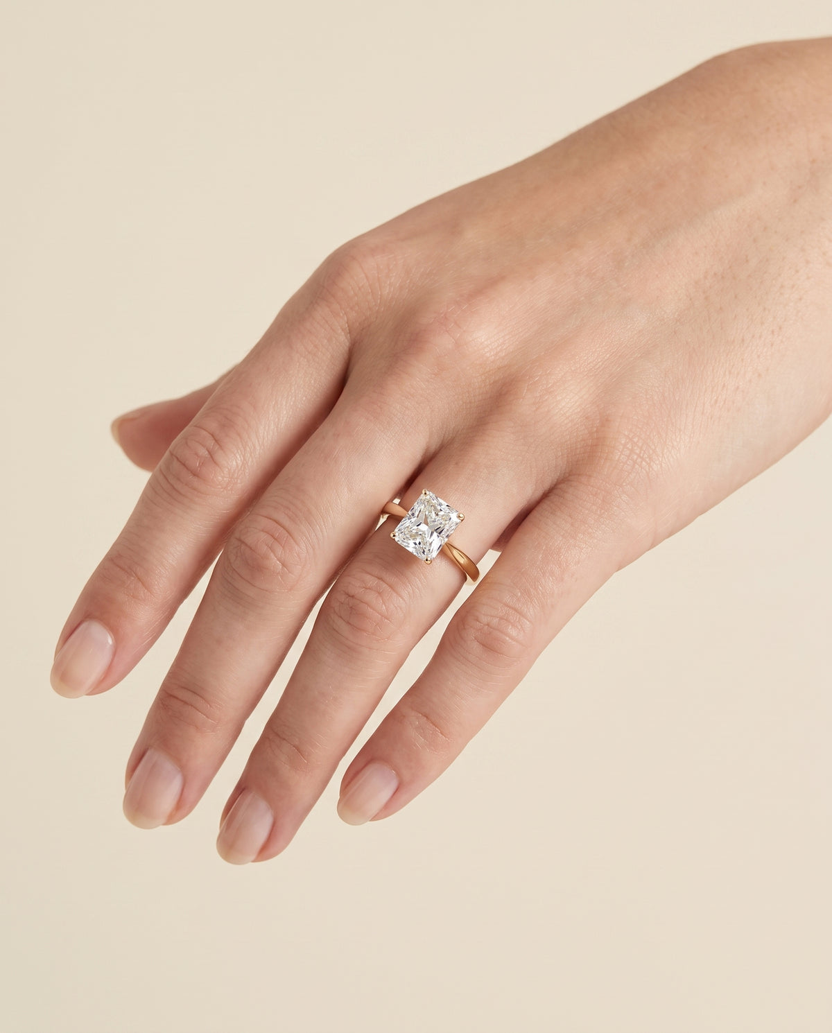 The Elena Timeless Graduated Beveled Shank Solitaire Radiant Cut Engagement Ring Setting in 18K Yellow Gold