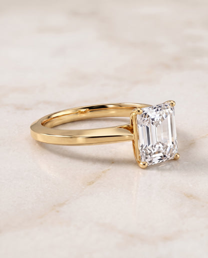 The Elena Timeless Graduated Beveled Shank Solitaire Radiant Cut Engagement Ring Setting in 18K Yellow Gold