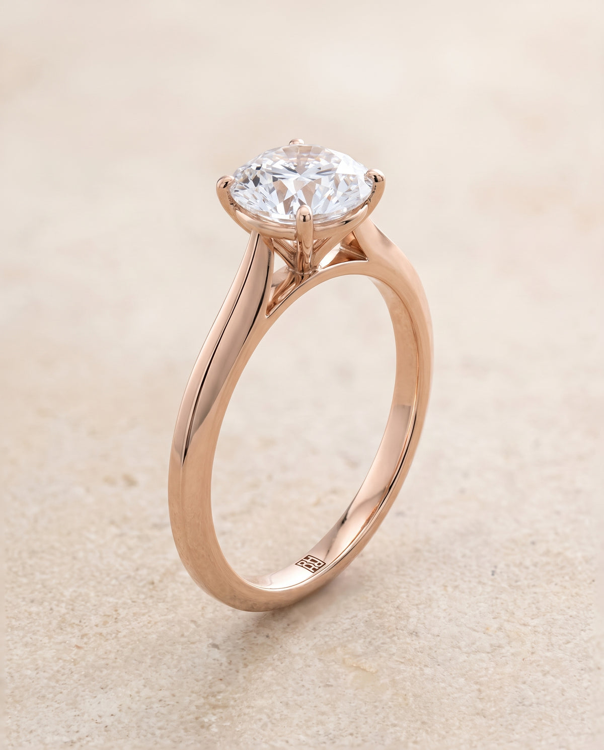 The Elena Timeless Graduated Beveled Shank Solitaire Round Engagement Ring Setting in 14K Rose Gold