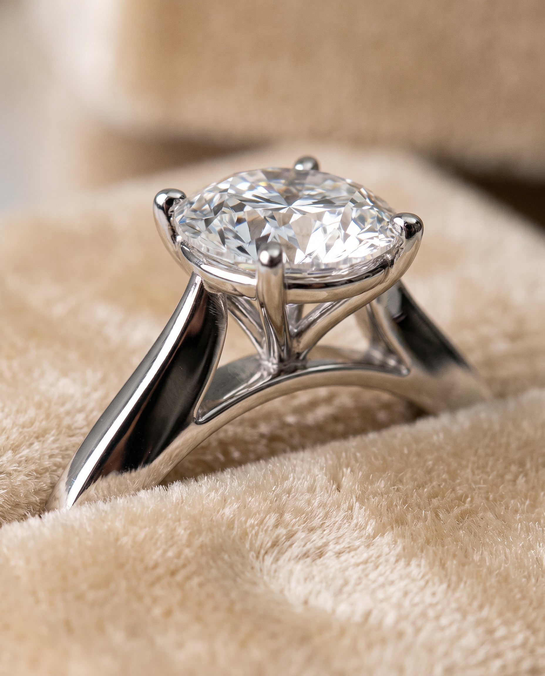 The Elena Timeless Graduated Beveled Shank Solitaire Round Engagement Ring Setting in 18K White Gold