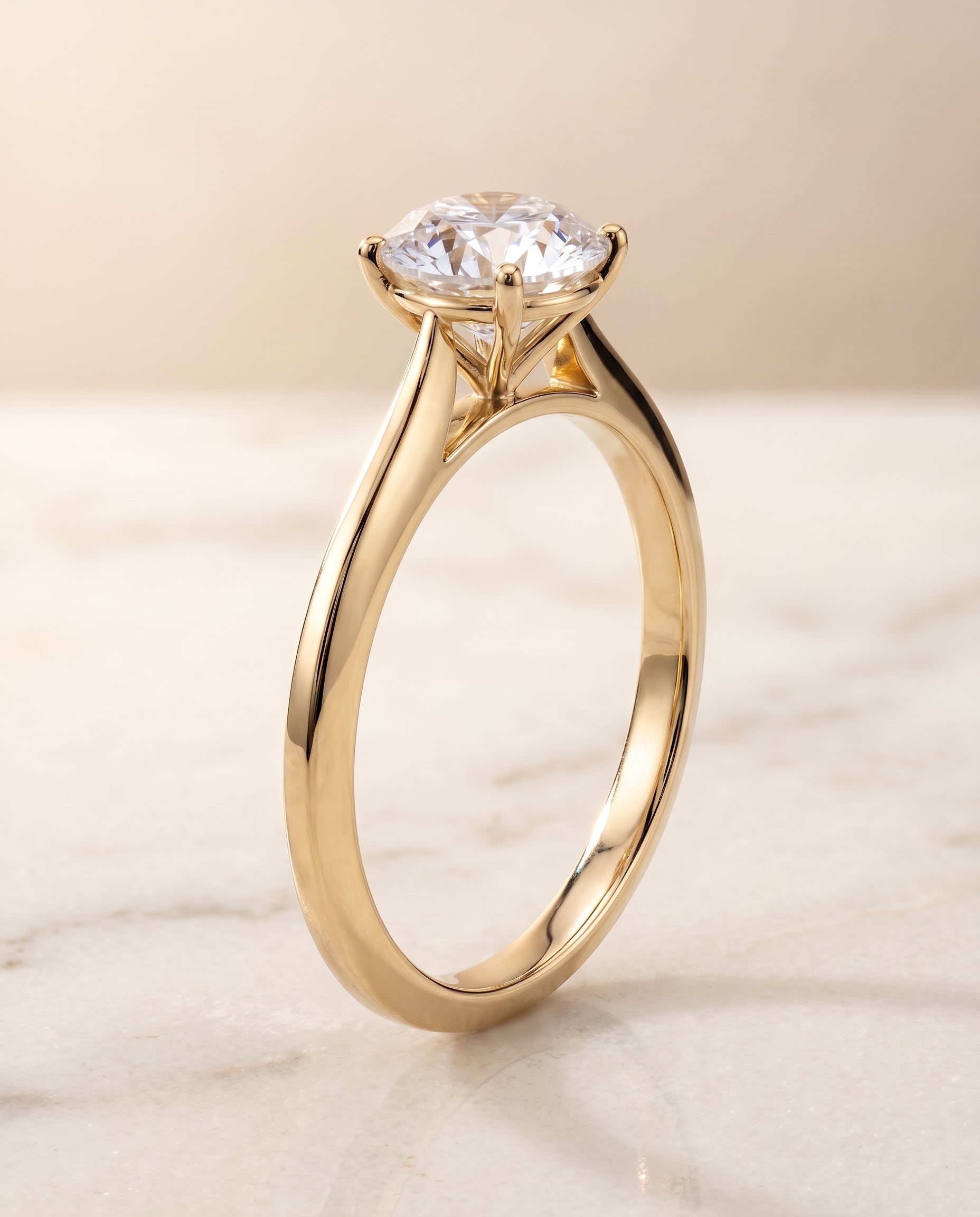 Timeless Graduated Beveled Shank Solitaire styling on The Elena round engagement ring setting | RockHer