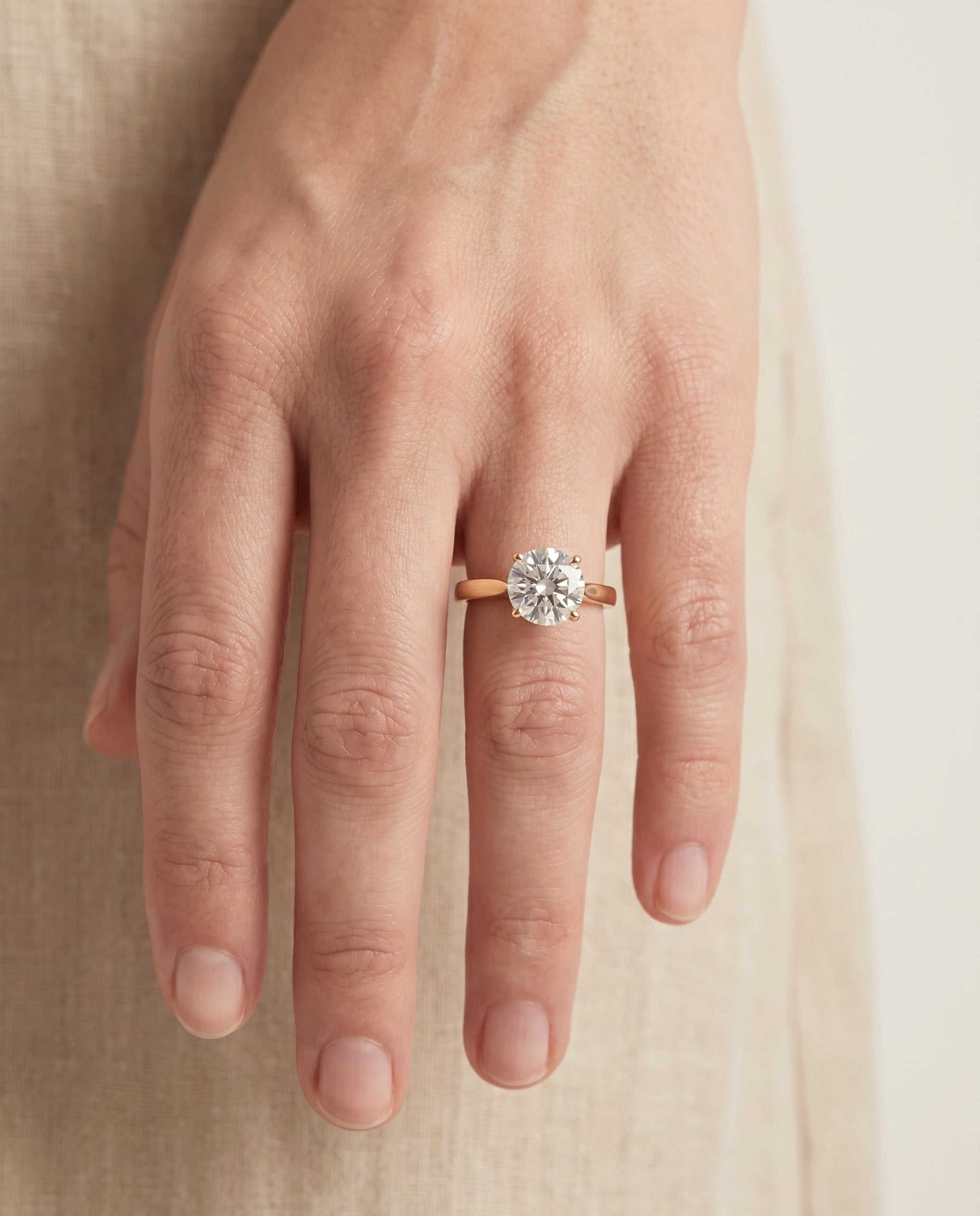 The Elena engagement ring setting in 18K Yellow Gold, timeless graduated beveled shank solitaire design | RockHer