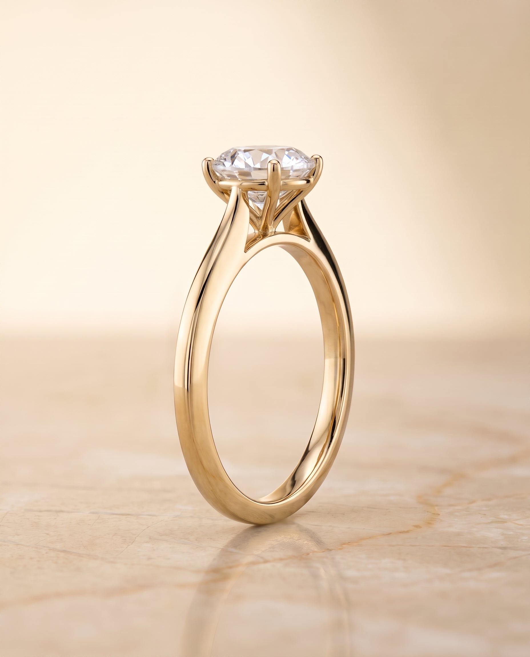 The Elena setting for round diamonds, made to order in 18K Yellow Gold | RockHer