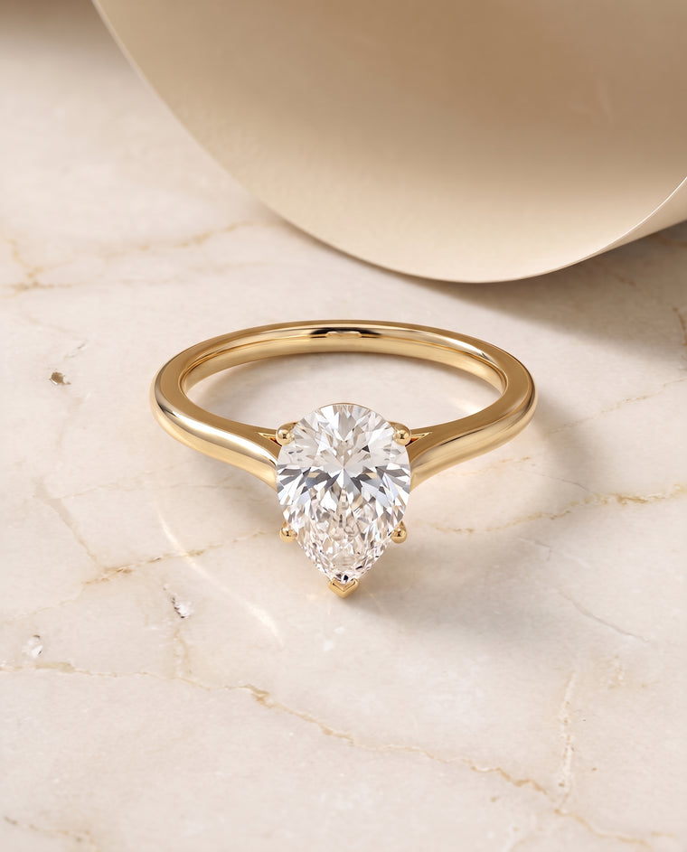 The Ellie Cathedral Comfort Fit Solitaire Pear Engagement Ring Setting in 18K Yellow Gold