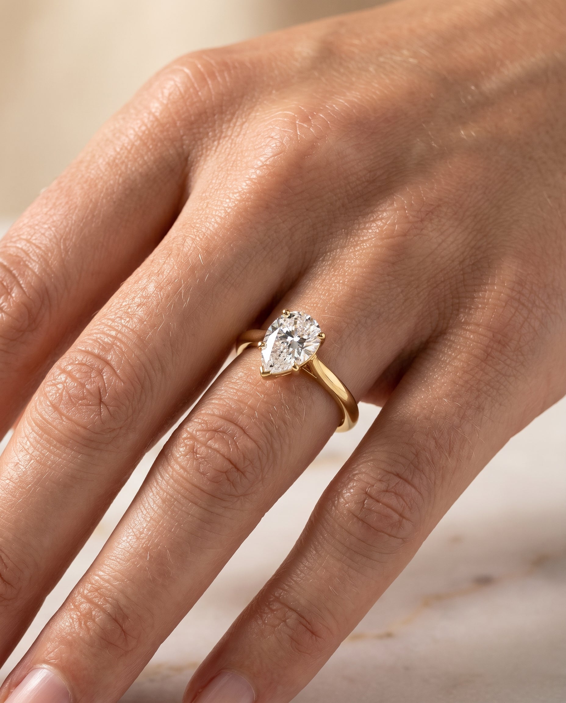 The Ellie engagement ring setting in 18K Yellow Gold, cathedral comfort fit solitaire design | RockHer