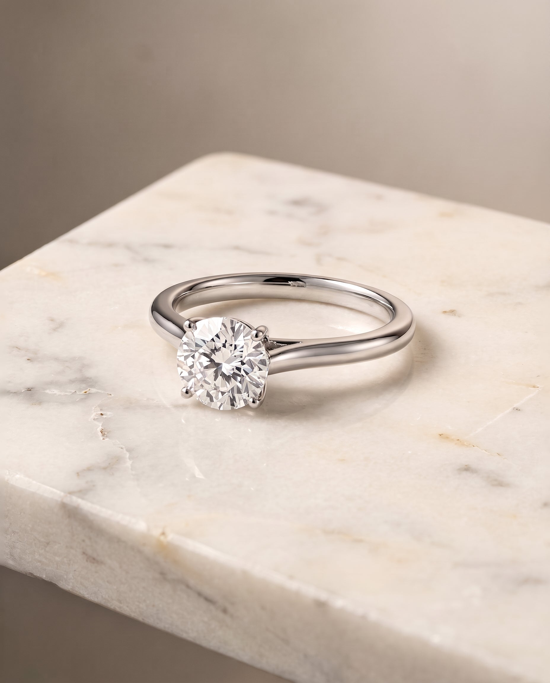 The Ellie Cathedral Comfort Fit Solitaire Round Engagement Ring Setting in 18K White Gold