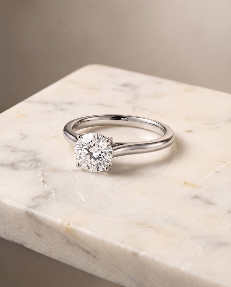 The Ellie Cathedral Comfort Fit Solitaire Round Engagement Ring Setting in 18K White Gold
