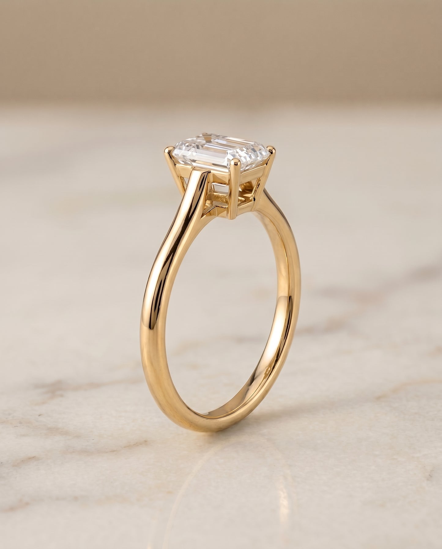 The Ellie Cathedral Comfort Fit Solitaire Emerald Cut Engagement Ring Setting in 18K Yellow Gold