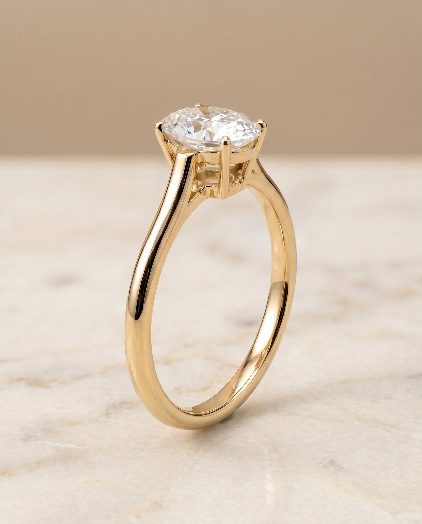 The Ellie Solitaire Engagement Ring Setting for Oval Diamonds in 18K Yellow Gold