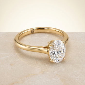 The Ellie Cathedral Comfort Fit Solitaire Oval Engagement Ring Setting in 18K Yellow Gold