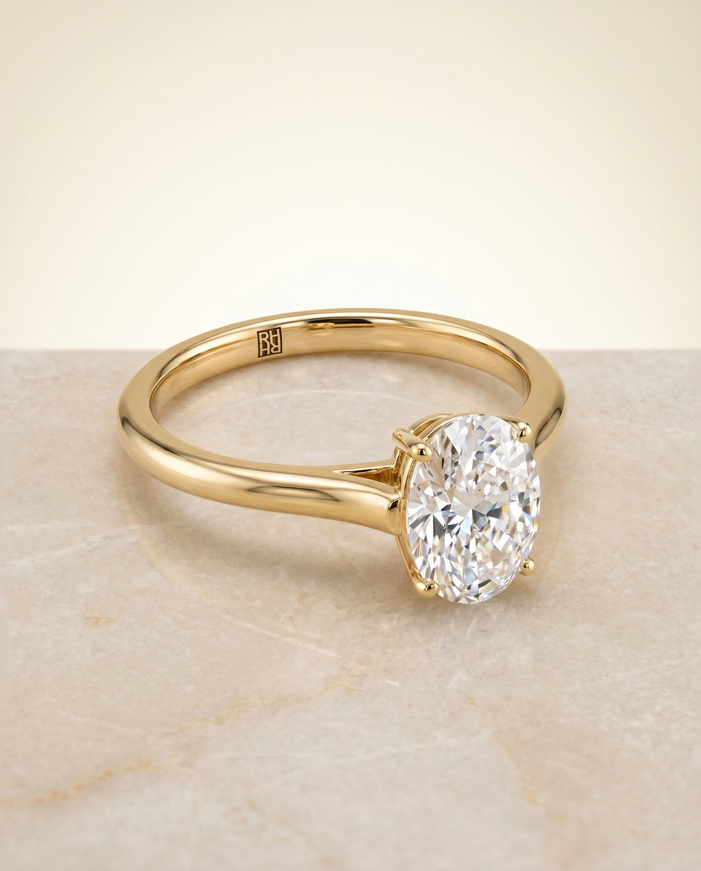 The Ellie Solitaire Engagement Ring Setting for Oval Diamonds in 18K Yellow Gold