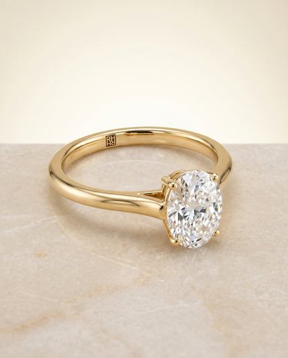 The Ellie Cathedral Comfort Fit Solitaire Oval Engagement Ring Setting in 18K Yellow Gold