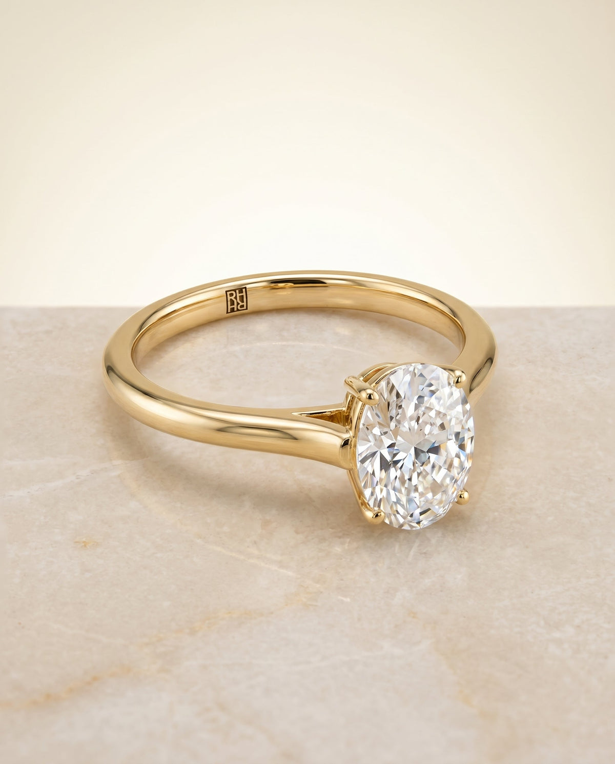 Ellie Select Solitaire Oval Lab Diamond Engagement Ring in 18K Yellow Gold, shown on hand, angled | RockHer