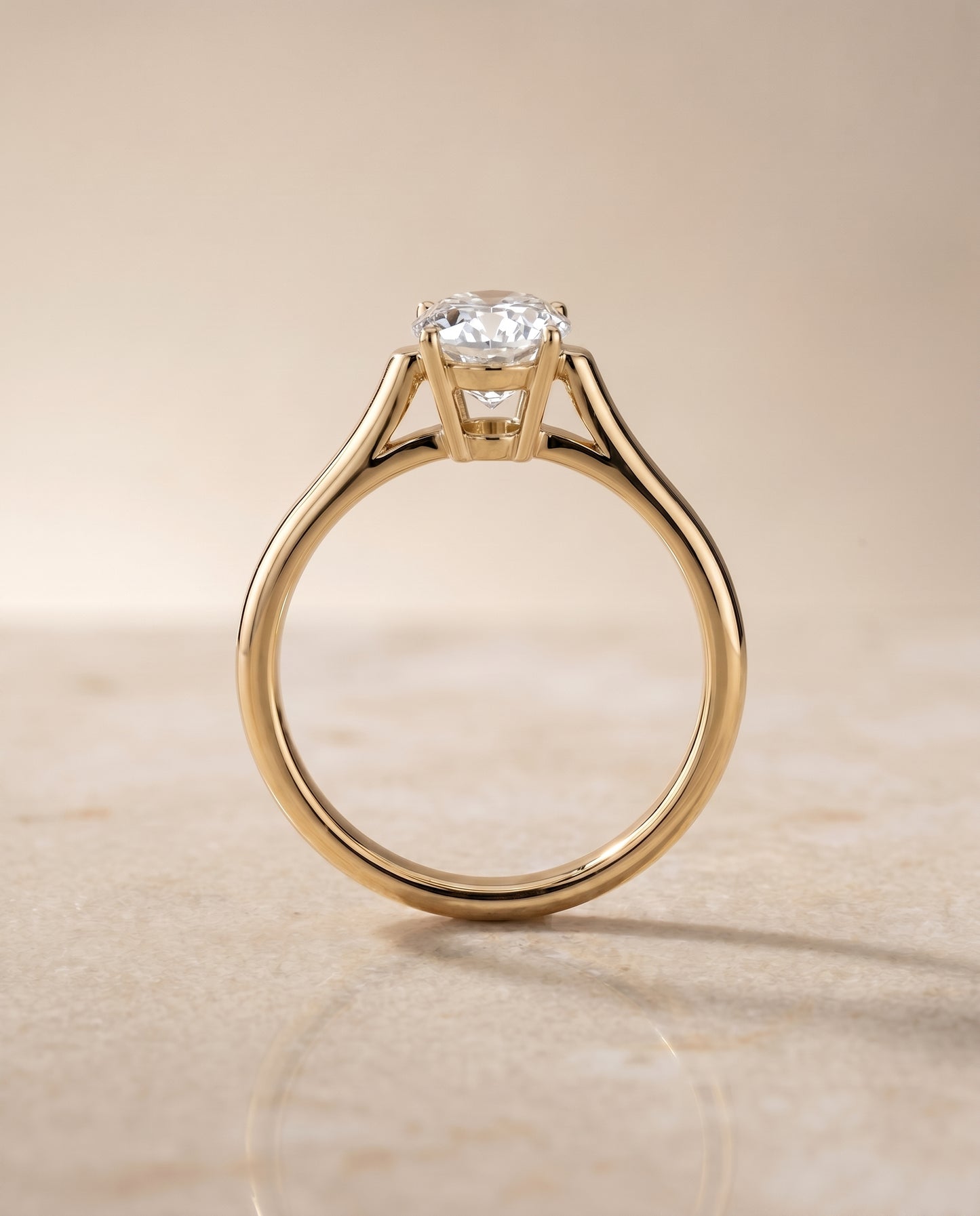 The Ellie Solitaire Engagement Ring Setting for Oval Diamonds in 18K Yellow Gold