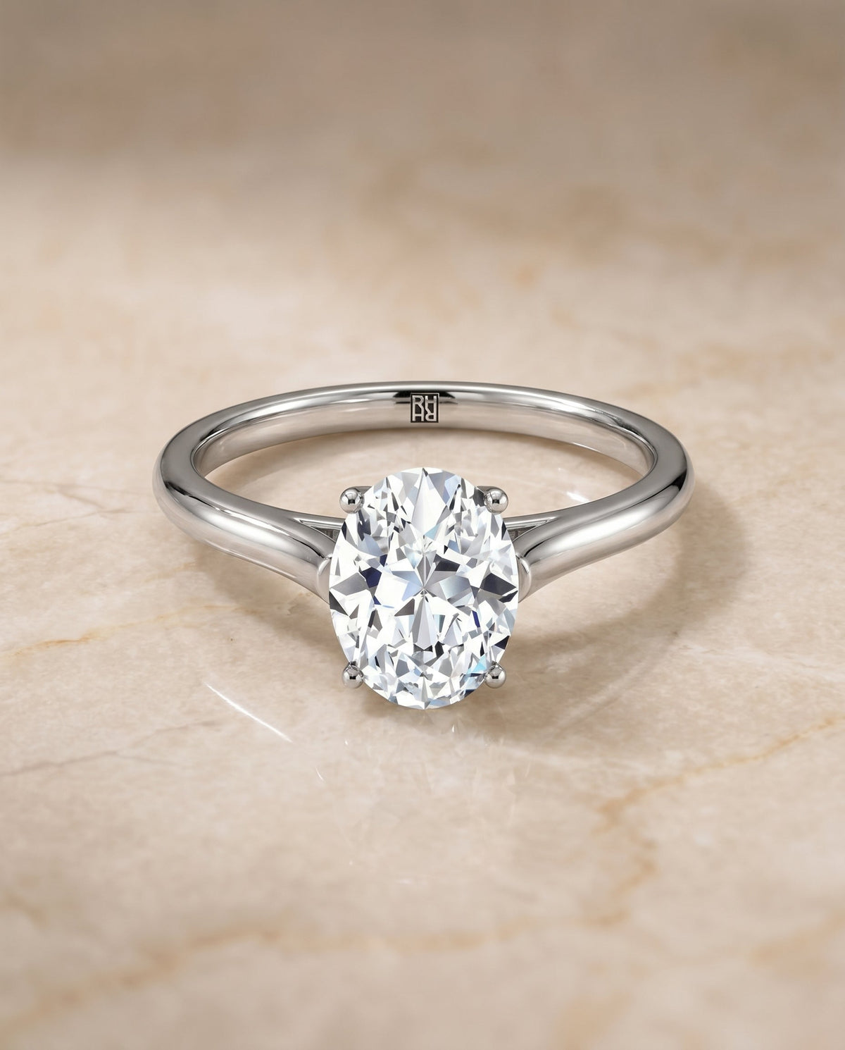 Ellie Select Solitaire Oval Lab Diamond Engagement Ring in 18K White Gold, shown on hand, angled | RockHer