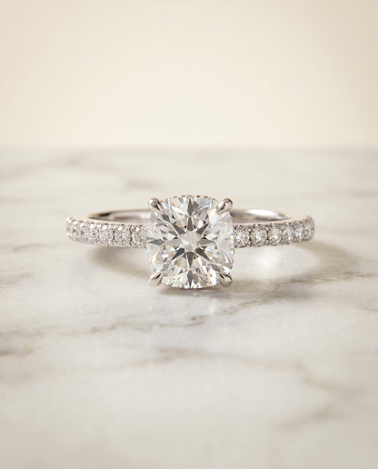 Elliott Select Hidden Halo Pavé Cushion Cut Lab Diamond Engagement Ring in 18K White Gold, shown on hand, angled | RockHer
