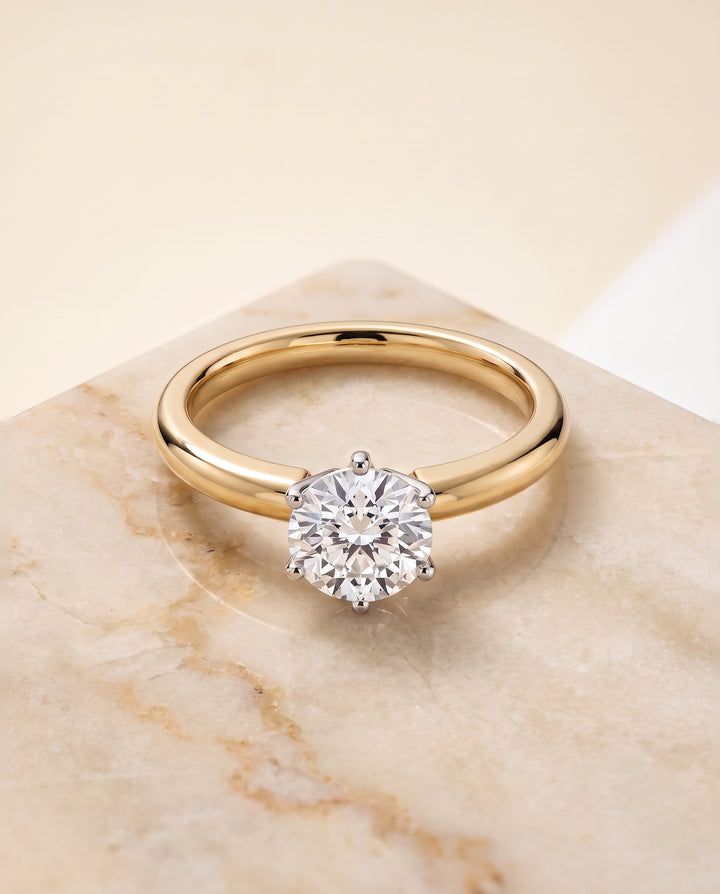 The Elsa Timeless Comfort Fit Rounded Solitaire Round Engagement Ring Setting in 18K Yellow Gold