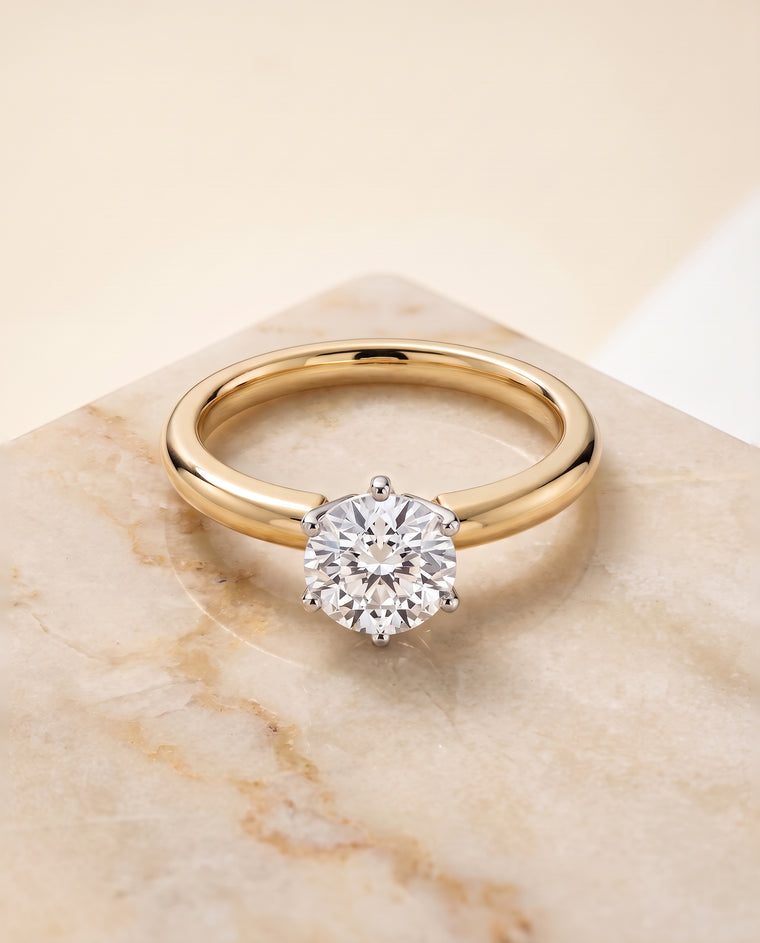The Elsa Timeless Comfort Fit Rounded Solitaire Round Engagement Ring Setting in 18K Yellow Gold