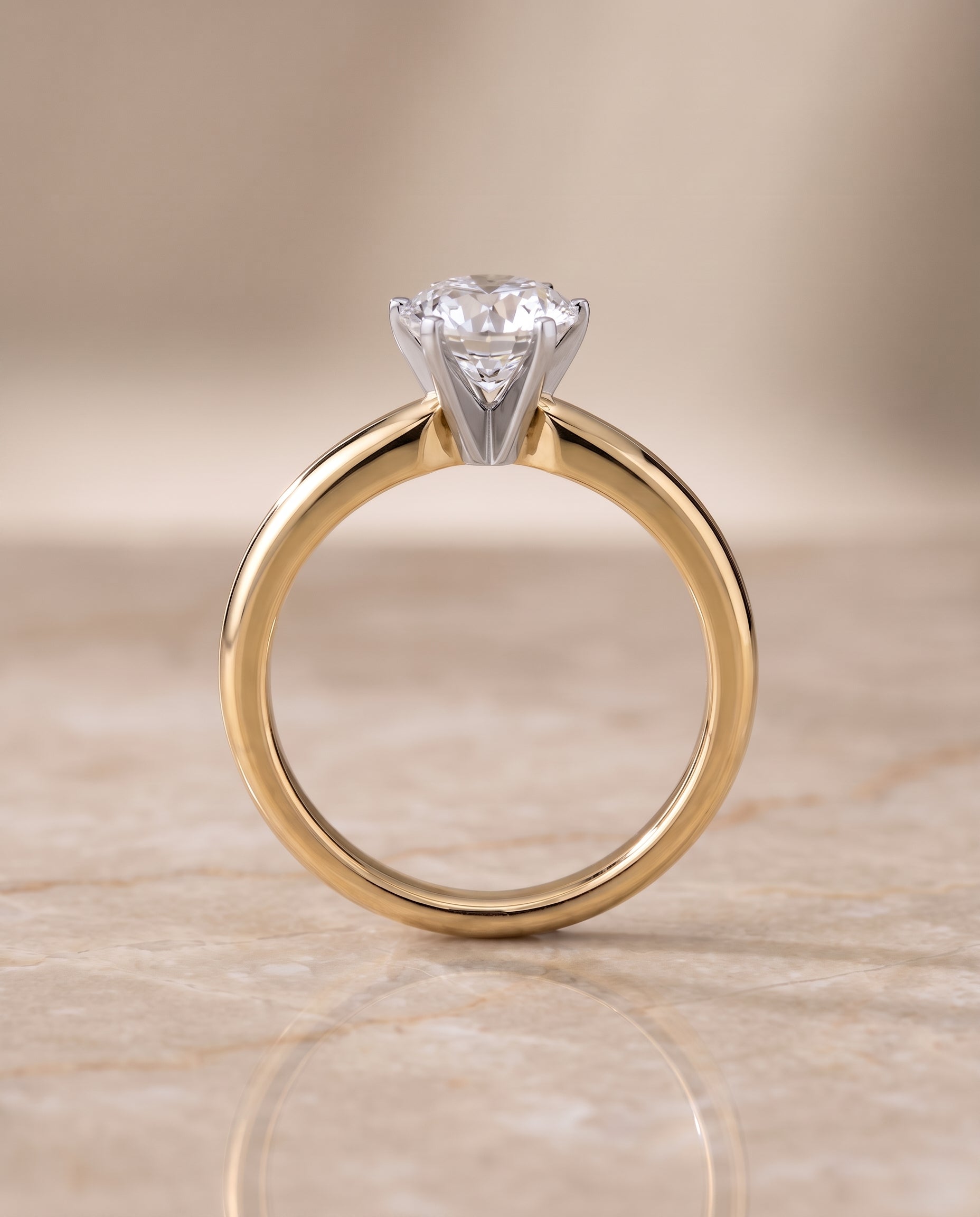 The Elsa setting for round diamonds, made to order in 18K Yellow Gold | RockHer