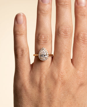 The Etta pear halo engagement ring in 18K yellow gold, the ring this matching band is cut for | RockHer