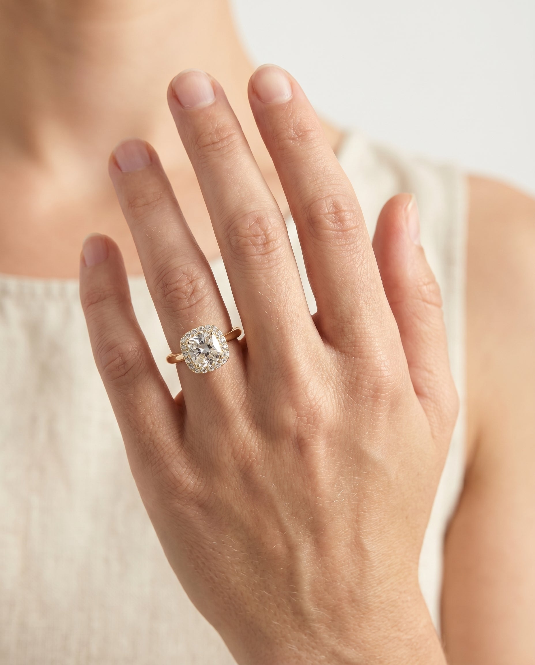 The Etta engagement ring setting in 18K Yellow Gold, classic shared prong halo cut design | RockHer