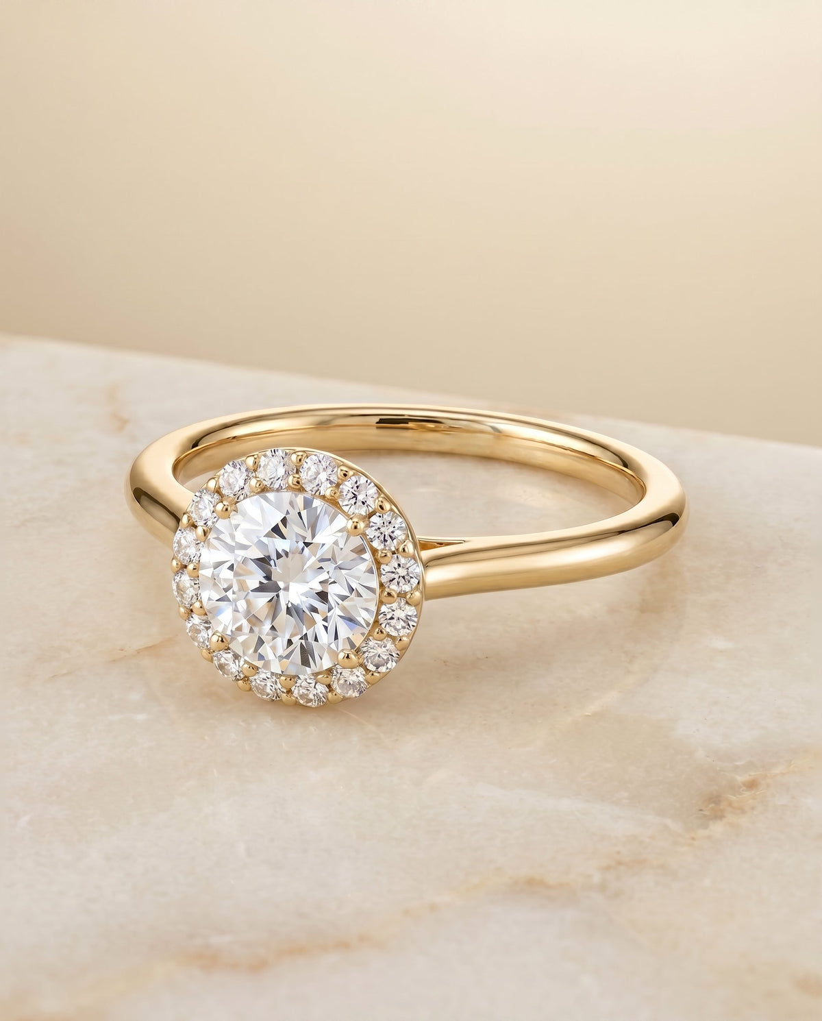 Etta Select Halo Round Lab Diamond Engagement Ring in 18K Yellow Gold, shown on hand, angled | RockHer
