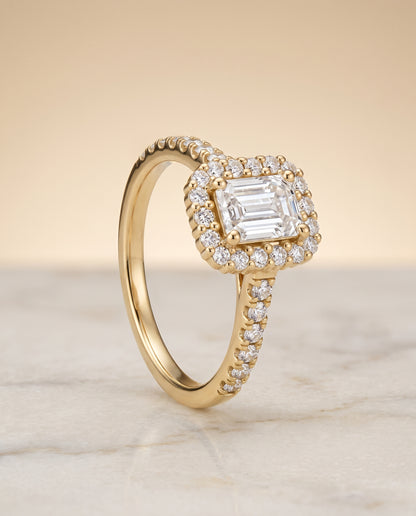 The Fiona Shared Prong Halo Emerald Cut Engagement Ring Setting in 18K Yellow Gold