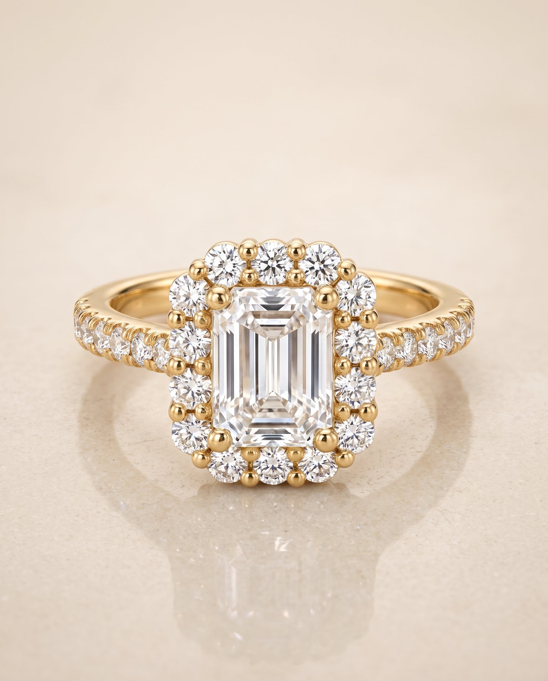 The Fiona Shared Prong Halo Emerald Cut Engagement Ring Setting in 18K Yellow Gold