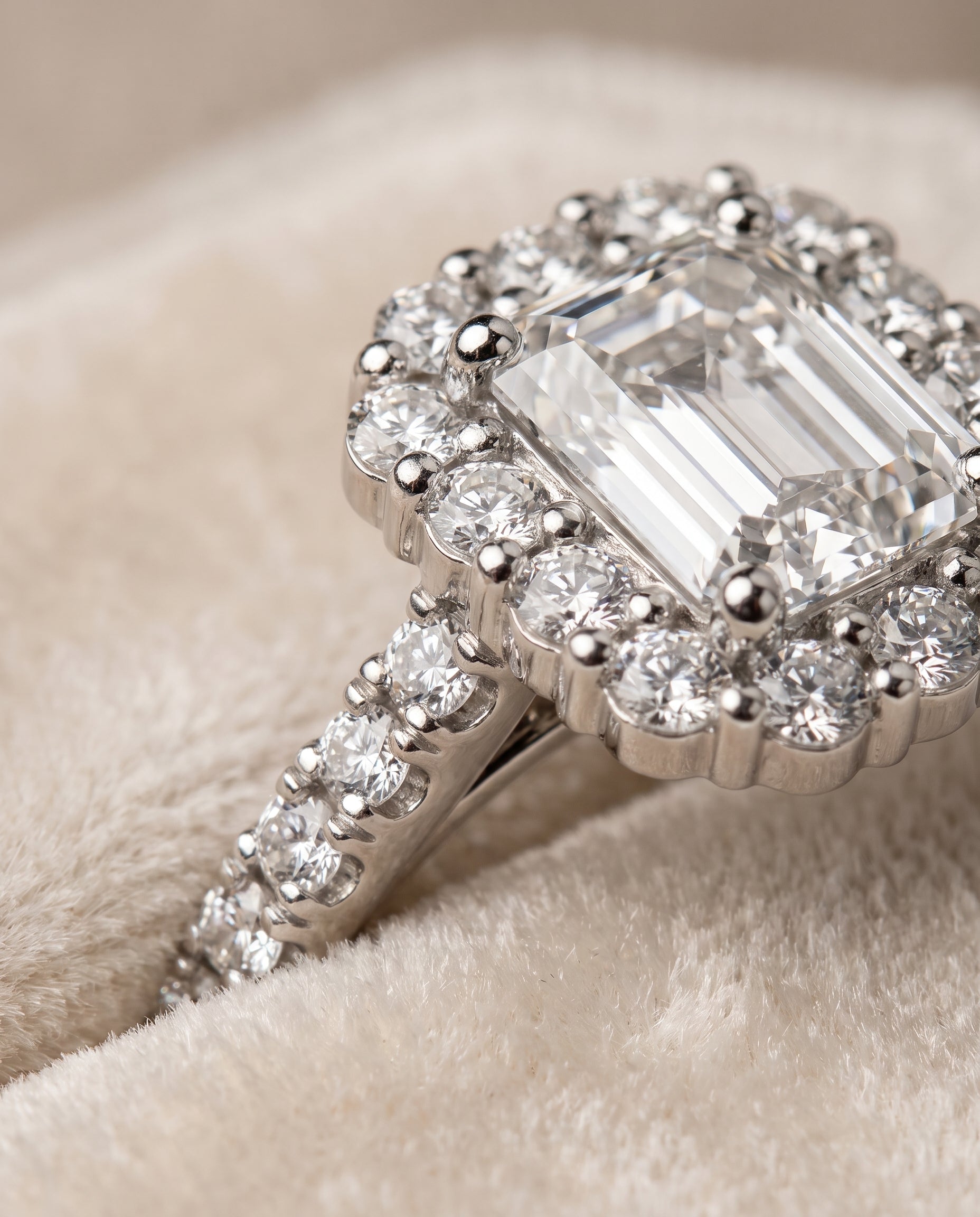 The Fiona Shared Prong Halo Emerald Cut Engagement Ring Setting in 18K White Gold