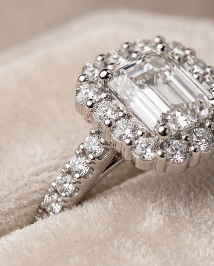 The Fiona Shared Prong Halo Emerald Cut Engagement Ring Setting in 18K White Gold