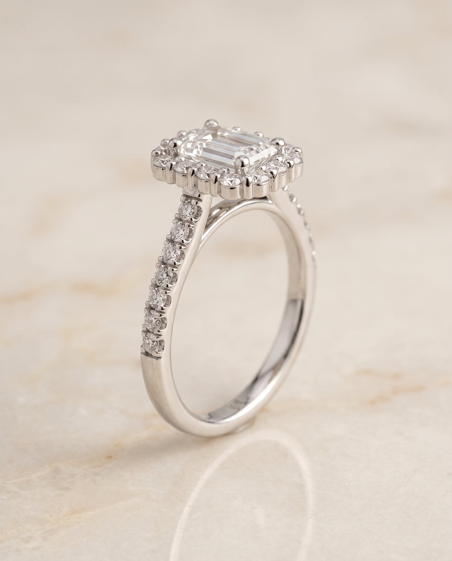 The Fiona Shared Prong Halo Emerald Cut Engagement Ring Setting in 18K White Gold
