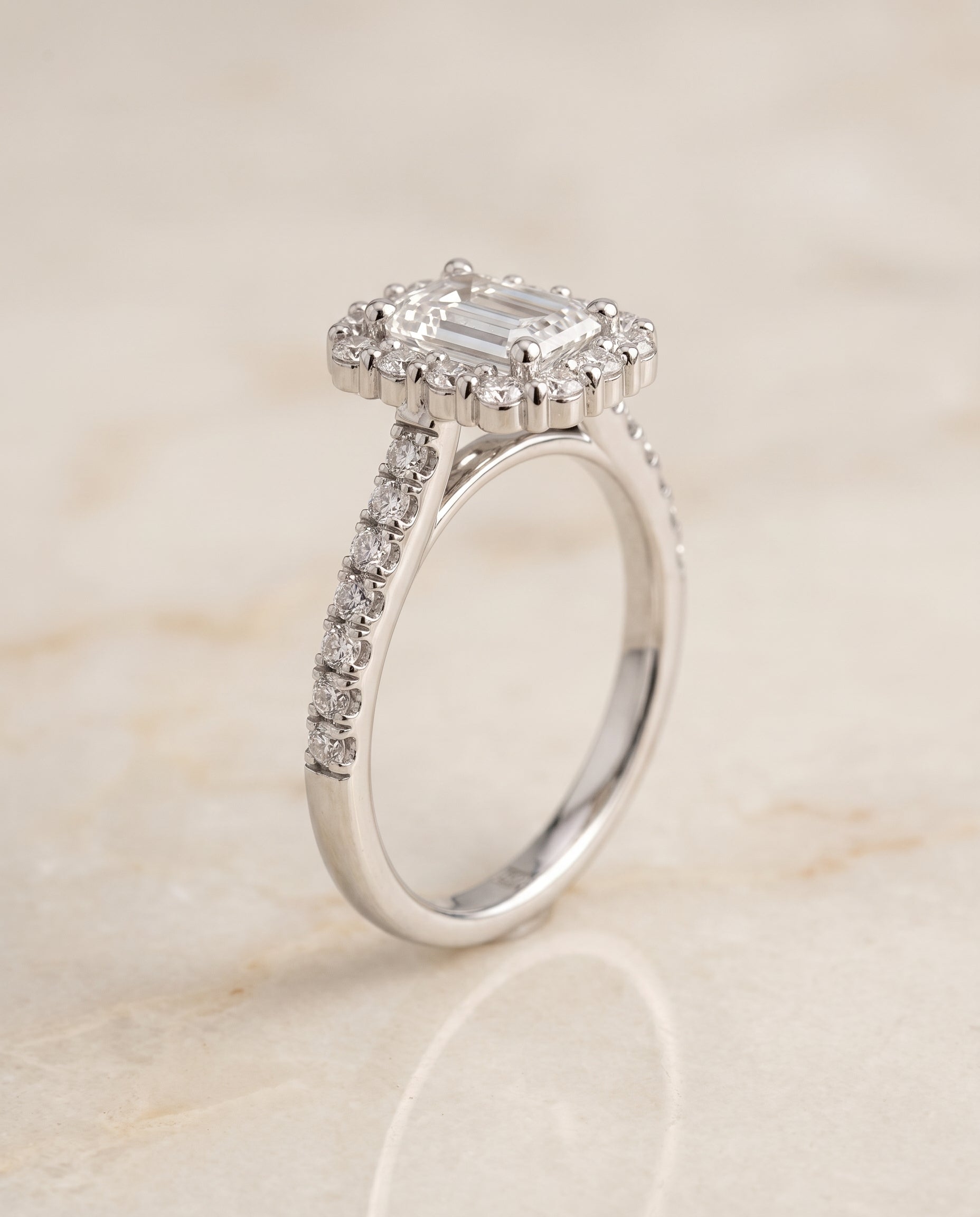 The Fiona Shared Prong Halo Emerald Cut Engagement Ring Setting in 18K White Gold