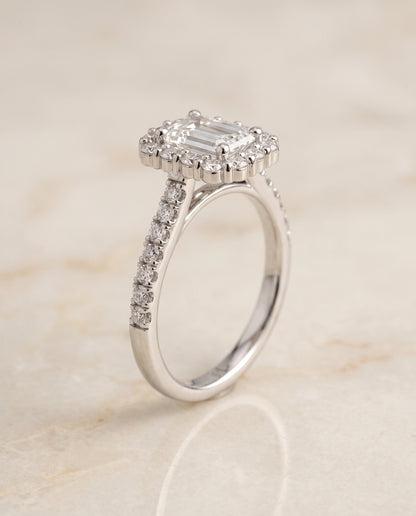 The Fiona Shared Prong Halo Emerald Cut Engagement Ring Setting in 18K White Gold