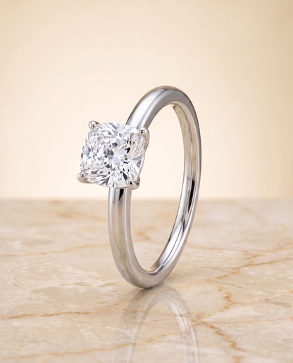 The Floria Comfort Fit Claw Prong Solitaire Cushion Cut Engagement Ring Setting in 18K White Gold
