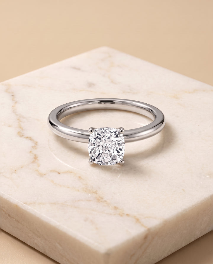 The Floria Comfort Fit Claw Prong Solitaire Cushion Cut Engagement Ring Setting in 18K White Gold