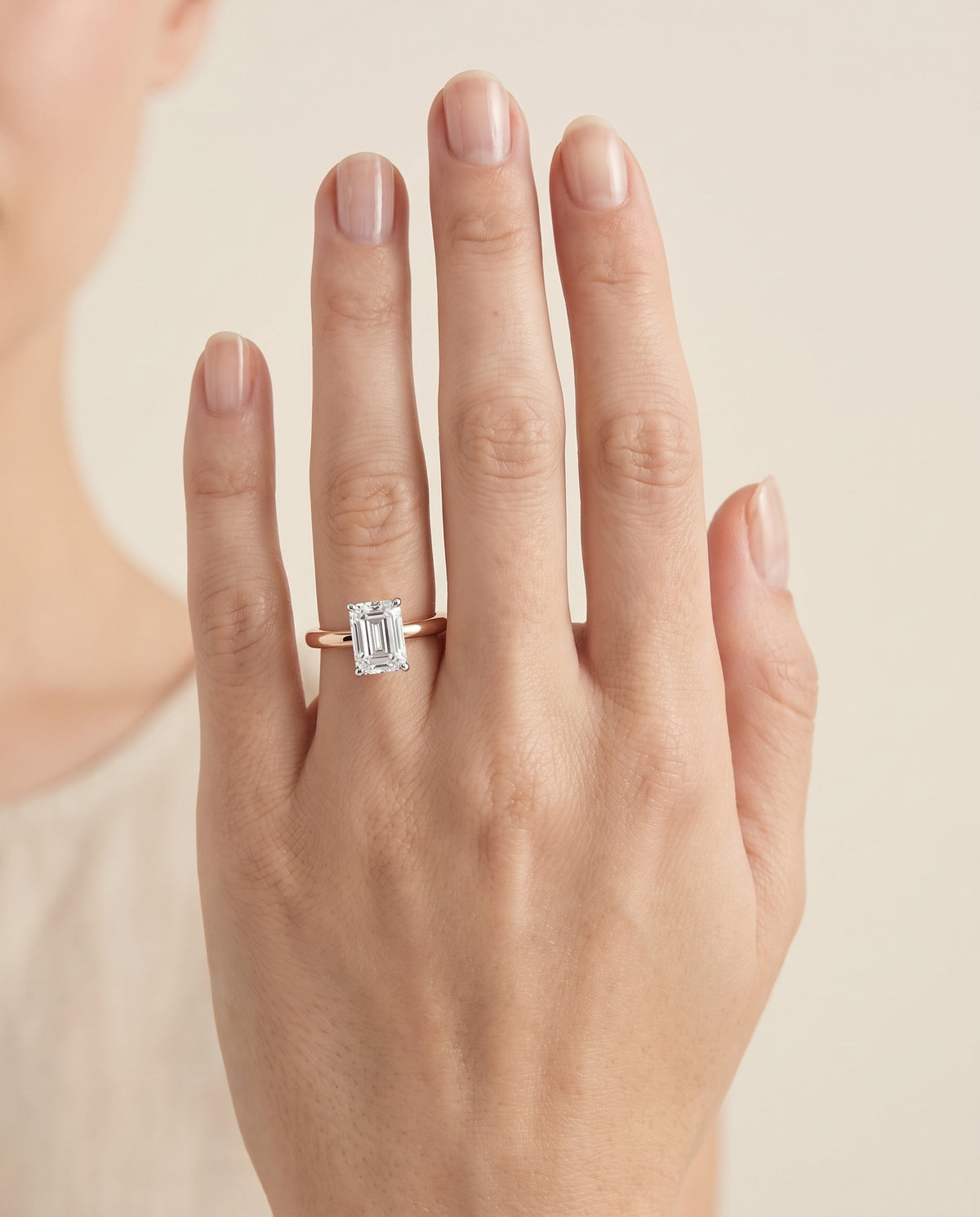 The Floria Comfort Fit Claw Prong Solitaire Emerald Cut Engagement Ring Setting in 14K Rose Gold