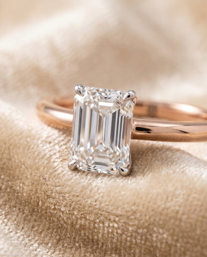 The Floria Comfort Fit Claw Prong Solitaire Emerald Cut Engagement Ring Setting in 14K Rose Gold