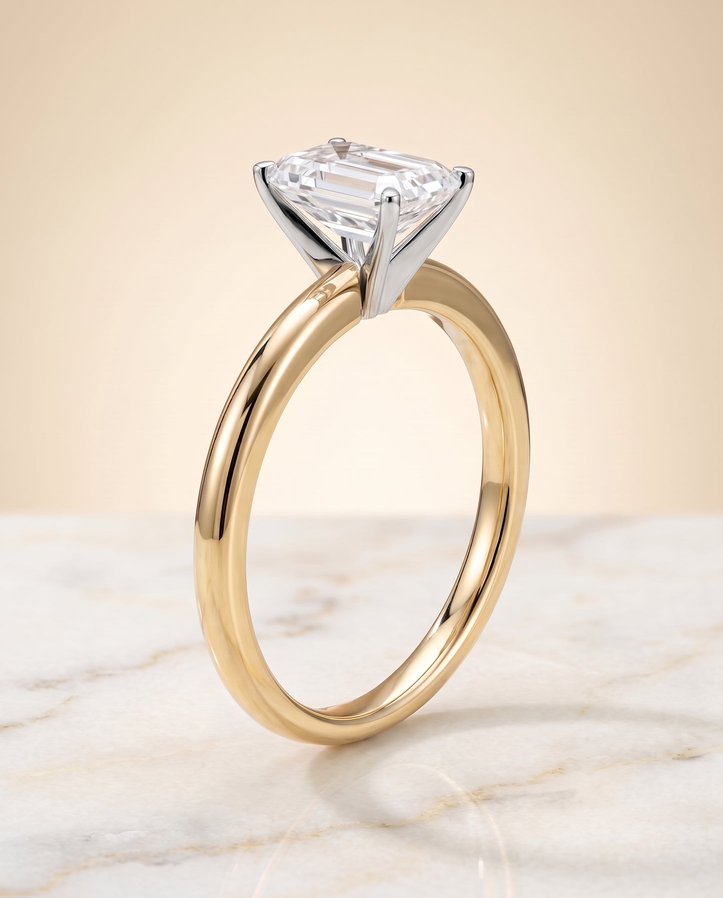 The Floria Comfort Fit Claw Prong Solitaire Emerald Cut Engagement Ring Setting in 18K Yellow Gold
