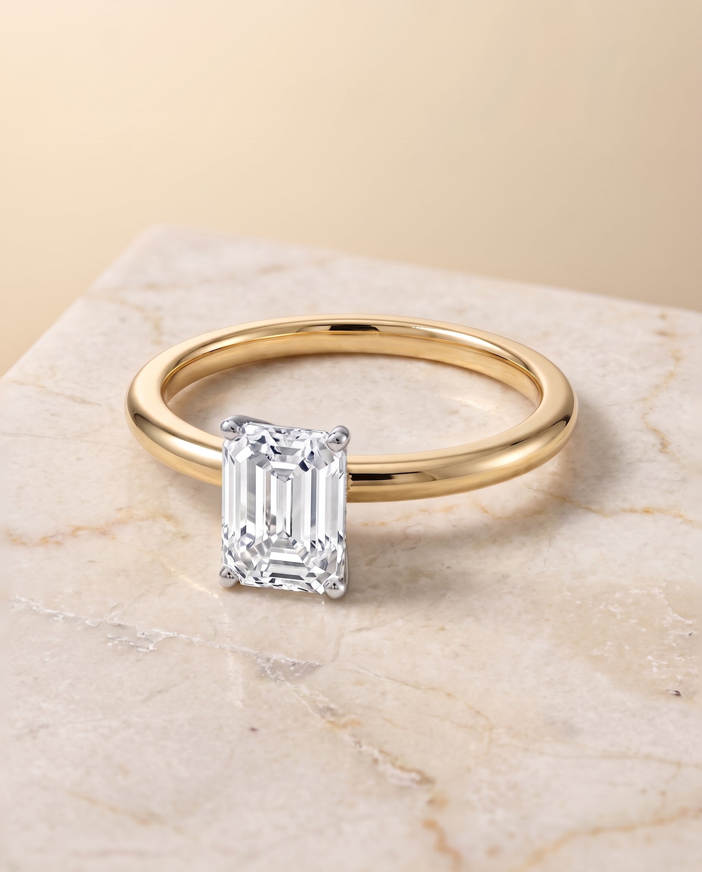 The Floria Comfort Fit Claw Prong Solitaire Emerald Cut Engagement Ring Setting in 18K Yellow Gold