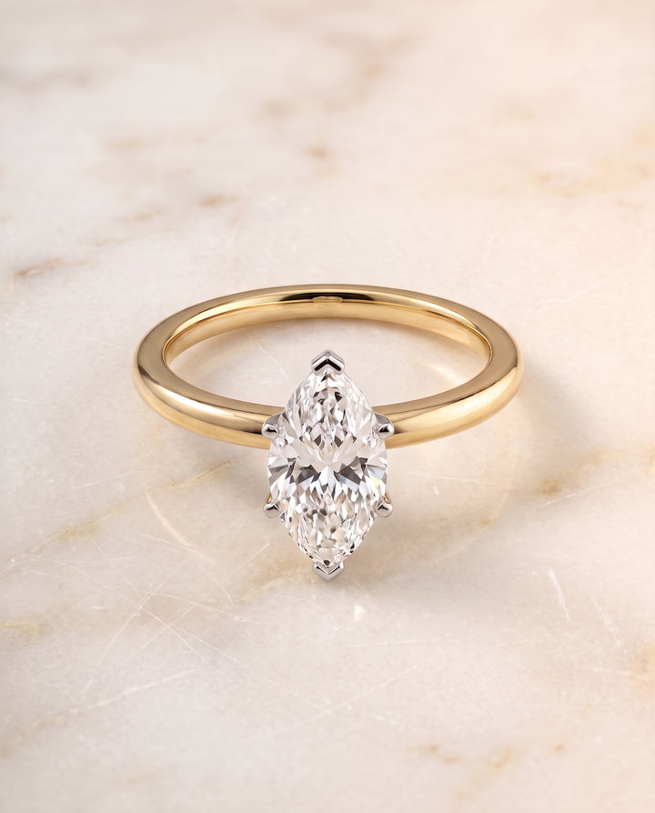 The Floria Comfort Fit Claw Prong Solitaire Marquise Engagement Ring Setting in 18K Yellow Gold