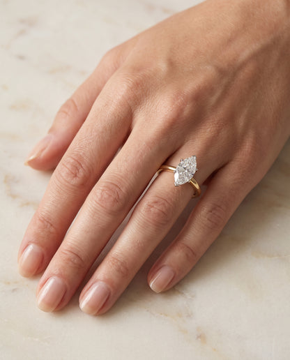The Floria Comfort Fit Claw Prong Solitaire Marquise Engagement Ring Setting in 18K Yellow Gold