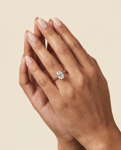 The Floria Comfort Fit Claw Prong Solitaire Oval Engagement Ring Setting in 14K Rose Gold
