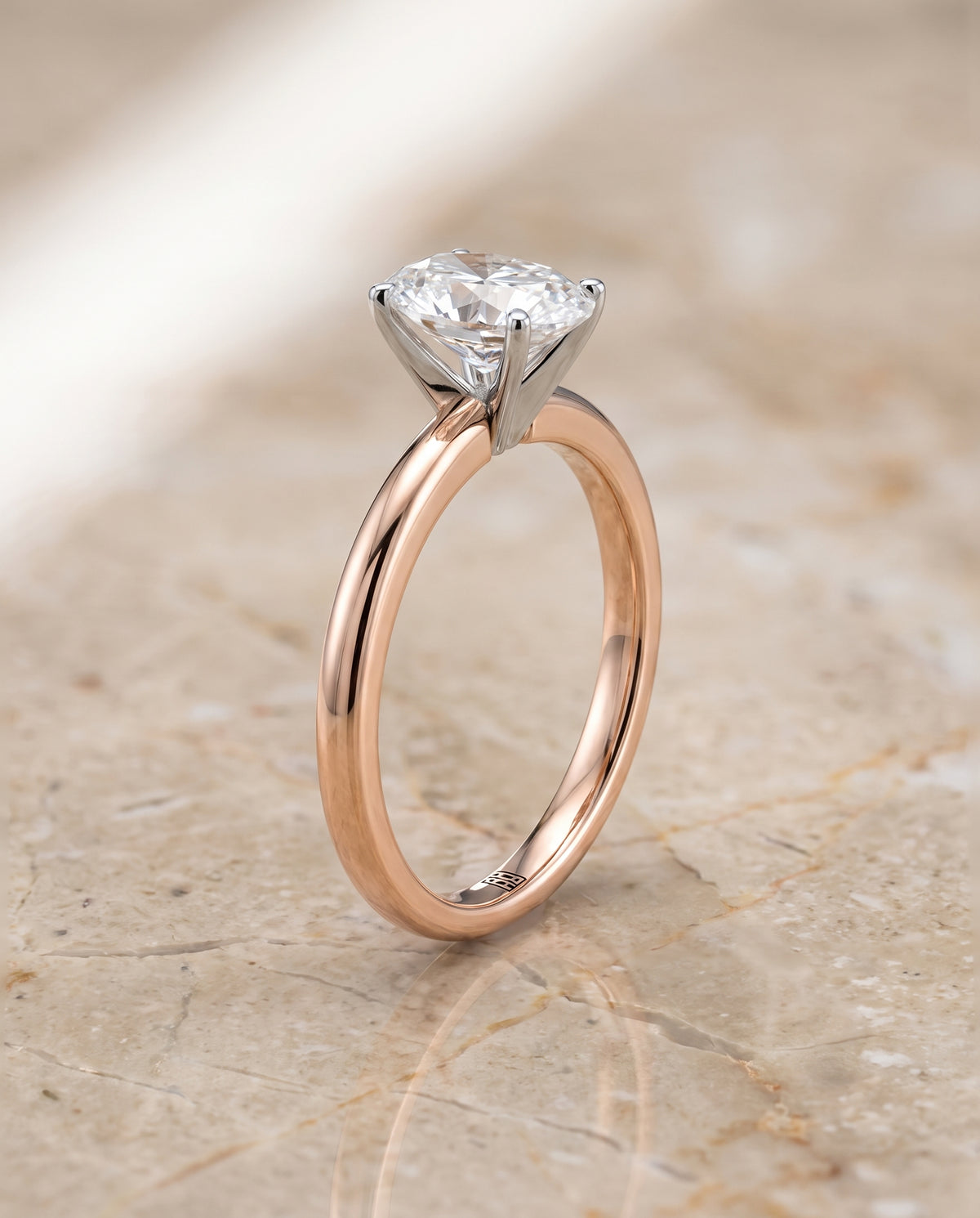 The Floria Comfort Fit Claw Prong Solitaire Oval Engagement Ring Setting in 14K Rose Gold