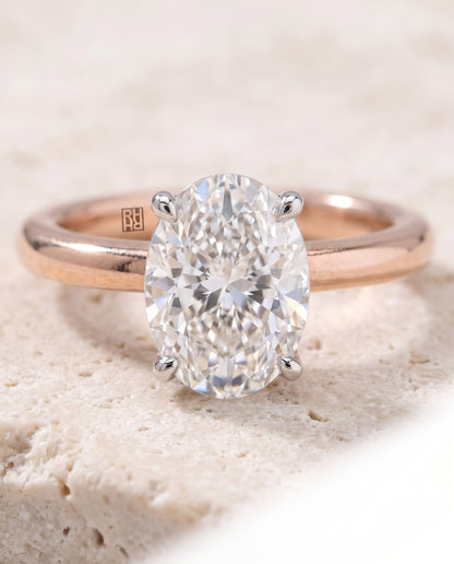 The Floria Comfort Fit Claw Prong Solitaire Oval Engagement Ring Setting in 14K Rose Gold