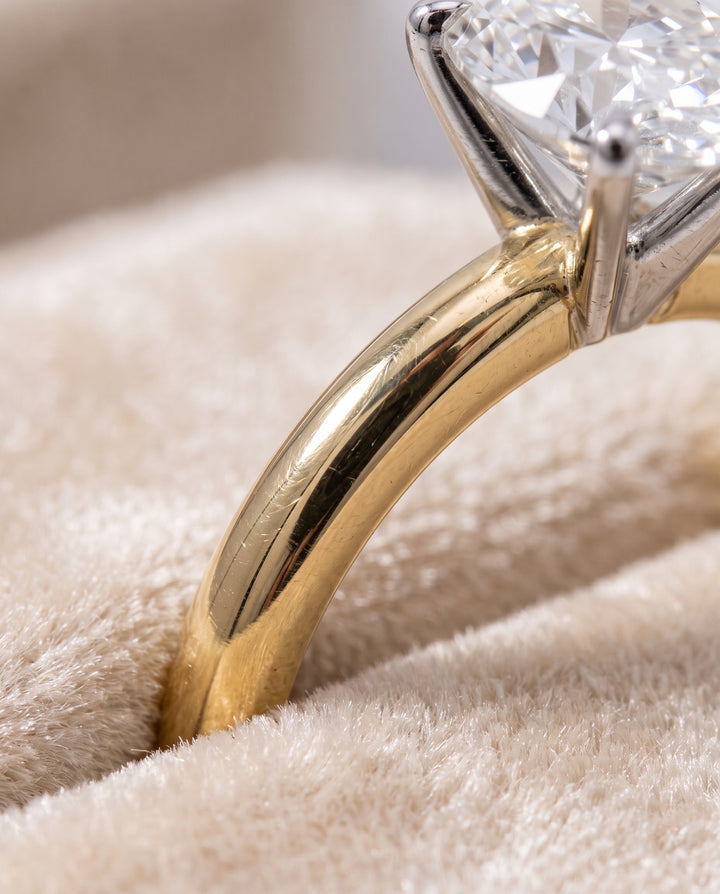 The Floria Comfort Fit Claw Prong Solitaire Oval Engagement Ring Setting in 18K Yellow Gold