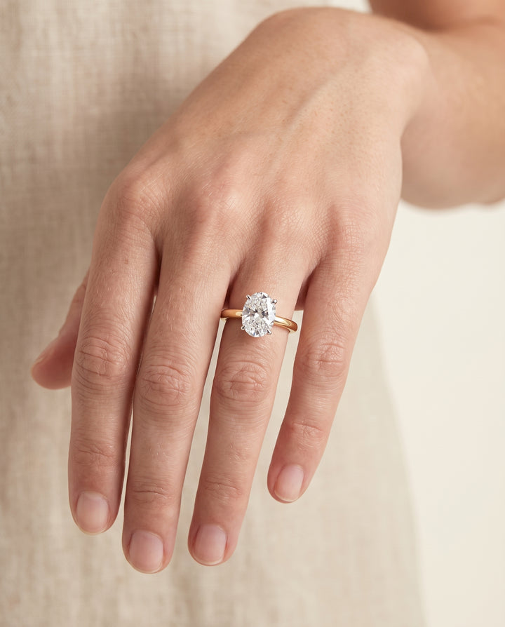 The Floria Comfort Fit Claw Prong Solitaire Oval Engagement Ring Setting in 18K Yellow Gold