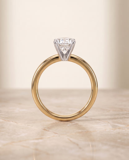 The Floria Comfort Fit Claw Prong Solitaire Oval Engagement Ring Setting in 18K Yellow Gold